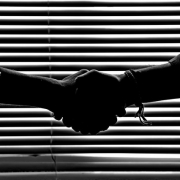 monochrome-photography-of-people-shaking-hands-814544