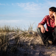 shallow-focus-photography-of-man-wearing-red-polo-shirt-920036