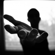 man-s-hand-in-shallow-focus-and-grayscale-photography-167964